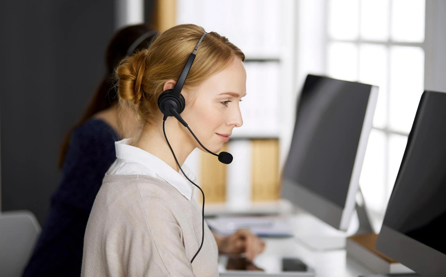 Caller with a headset talking to a prospect